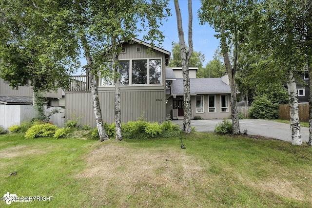 2629 Legacy Dr, Anchorage, AK 99516 - back of property featuring a patio area and a shingled roof