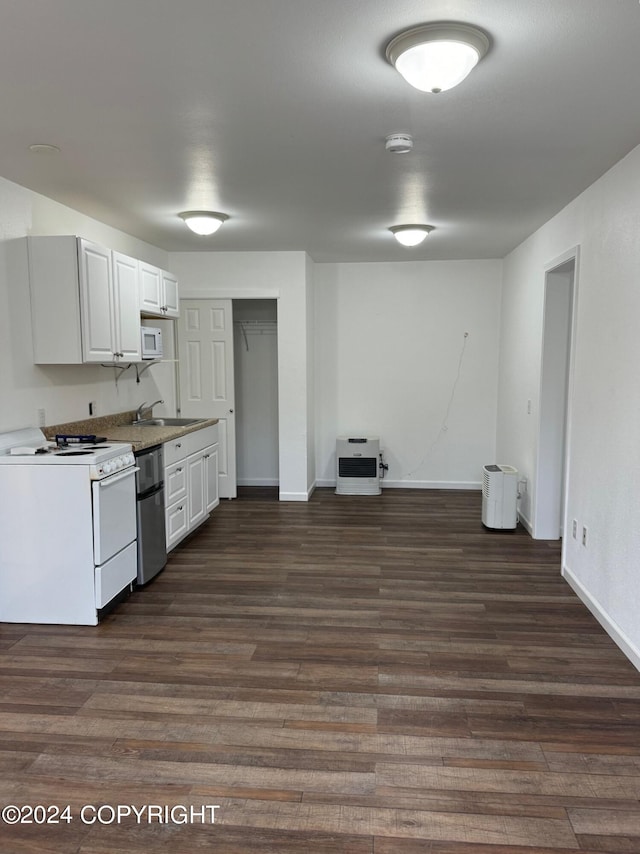 kitchen with dark hardwood / wood-style floors, heating unit, dishwashing machine, white cabinets, and white stove