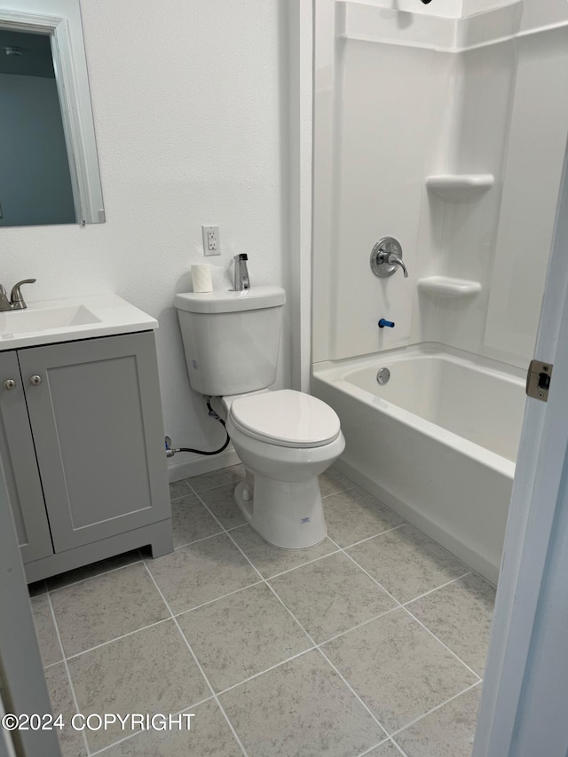 full bathroom with tile patterned floors,  shower combination, toilet, and vanity