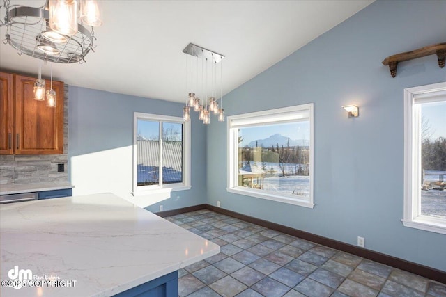 unfurnished dining area with vaulted ceiling and a chandelier