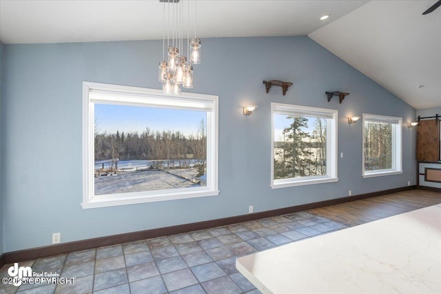 unfurnished dining area featuring lofted ceiling and a notable chandelier