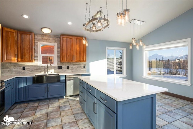 kitchen with tasteful backsplash, sink, hanging light fixtures, a center island, and stainless steel appliances