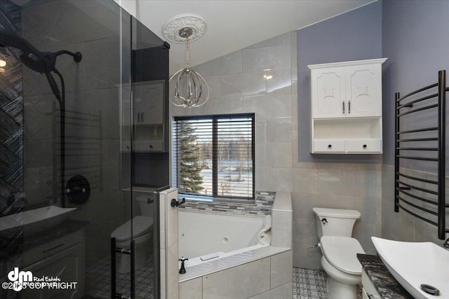 full bathroom with radiator heating unit, lofted ceiling, tile walls, separate shower and tub, and toilet