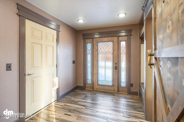 entryway with dark wood-type flooring