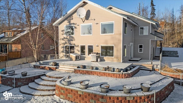 back of house featuring a wooden deck