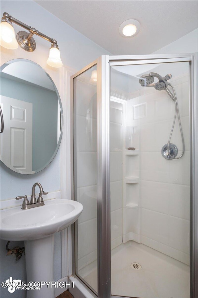 bathroom with an enclosed shower