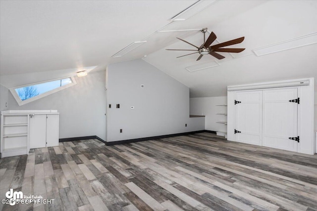 bonus room featuring ceiling fan, lofted ceiling, and hardwood / wood-style floors