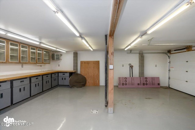 garage featuring a wall unit AC