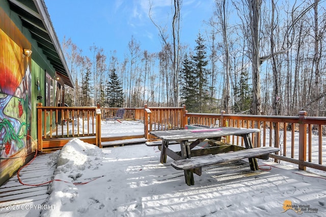 view of snow covered deck