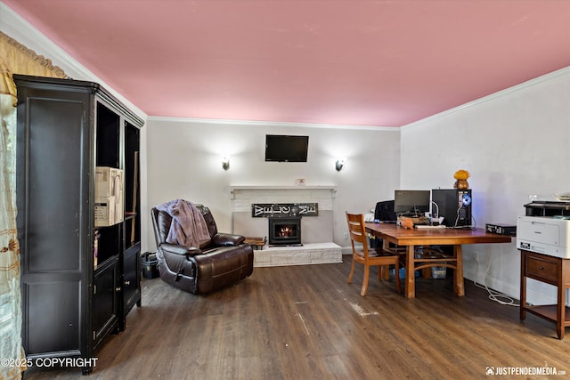 1510 E 40th Ct, Anchorage, AK 99508 - office area featuring dark wood finished floors, a warm lit fireplace, and ornamental molding