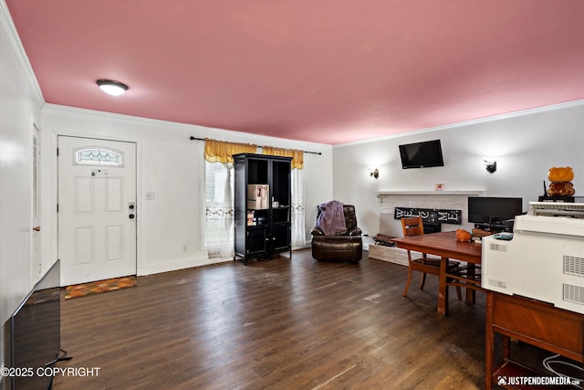 1510 E 40th Ct, Anchorage, AK 99508 - foyer with a fireplace with raised hearth, ornamental molding, and dark wood-type flooring