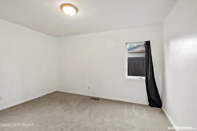 1510 E 40th Ct, Anchorage, AK 99508 - spare room featuring carpet and baseboards