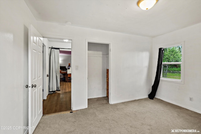 1510 E 40th Ct, Anchorage, AK 99508 - unfurnished bedroom with a closet and carpet flooring