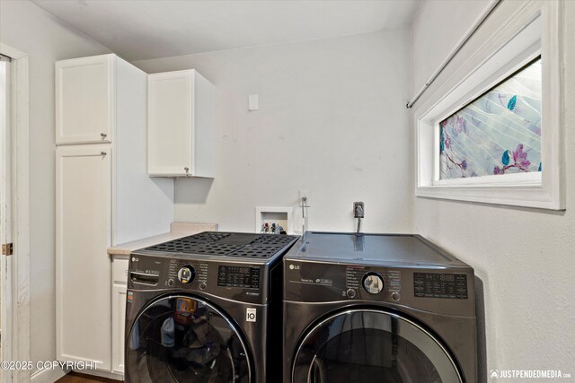 1510 E 40th Ct, Anchorage, AK 99508 - washroom featuring washing machine and dryer and cabinet space
