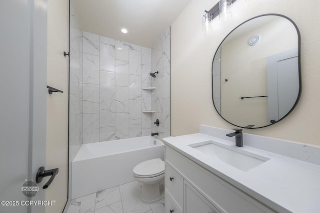 full bathroom featuring tiled shower / bath combo, vanity, and toilet