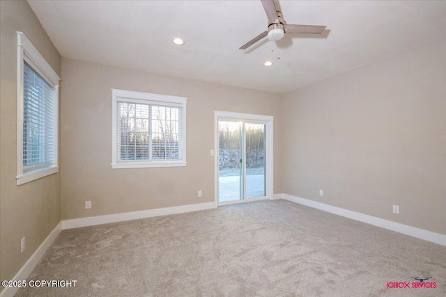 unfurnished room featuring ceiling fan and light carpet