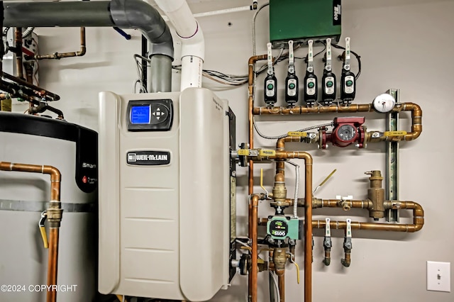 utility room with secured water heater and water heater