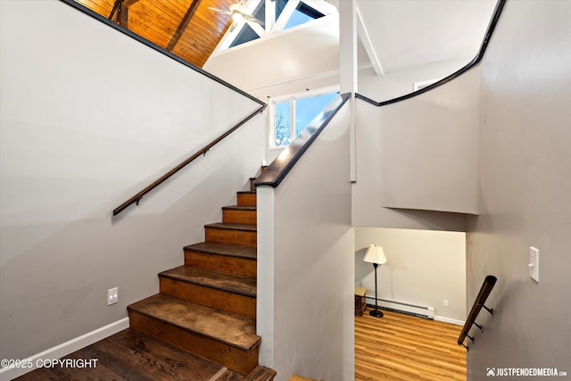 stairway with a baseboard heating unit, high vaulted ceiling, wood ceiling, and wood-type flooring