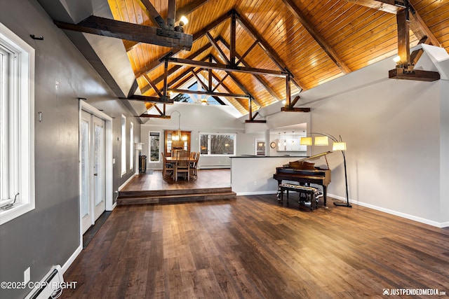 interior space with a wealth of natural light, dark hardwood / wood-style flooring, and beam ceiling