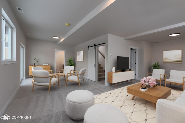 carpeted living room featuring a barn door