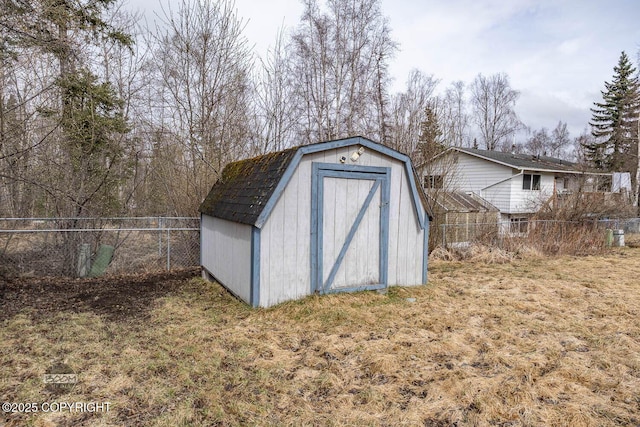 view of shed with a fenced backyard
