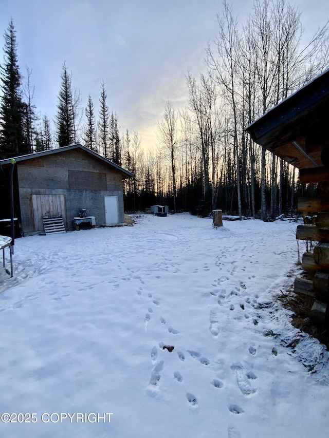 view of yard covered in snow