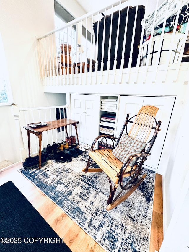 sitting room with hardwood / wood-style flooring