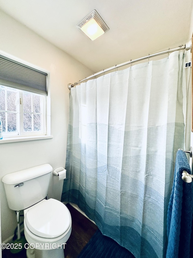 bathroom featuring toilet