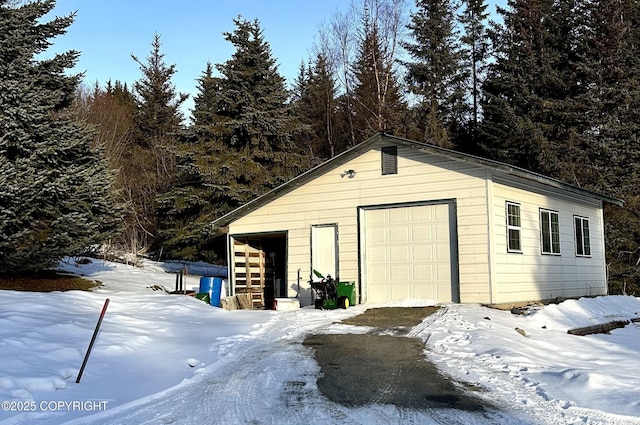 view of snow covered garage