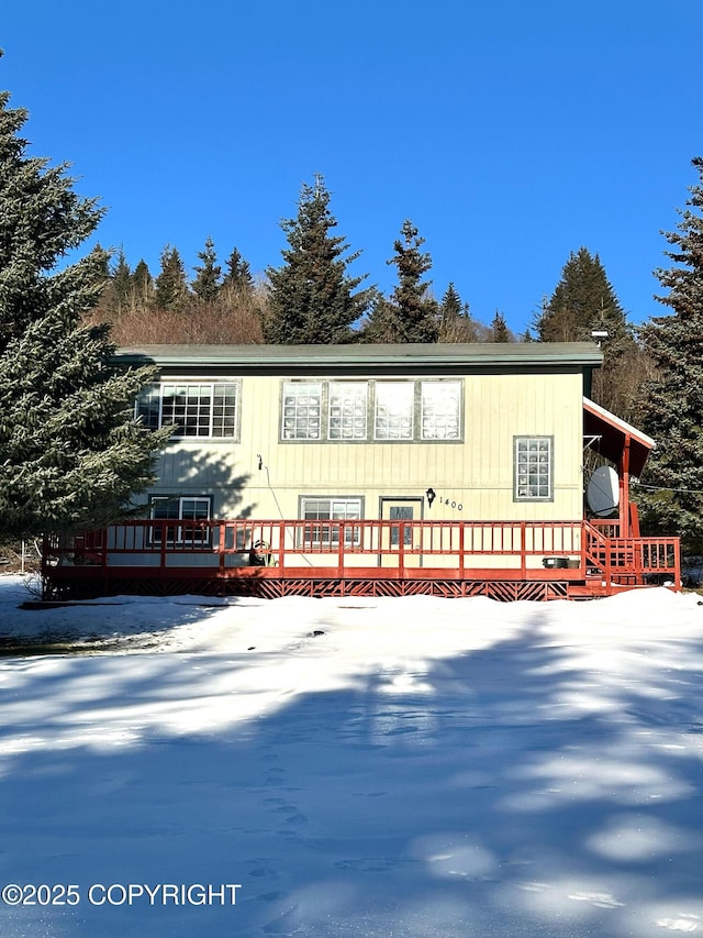 view of front facade with a wooden deck