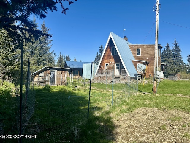 1060 Jeffery Ave, Homer, AK 99603 - rear view of property featuring a chimney and metal roof