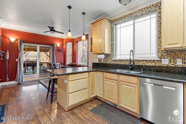 kitchen with sink, hanging light fixtures, dark hardwood / wood-style floors, dishwasher, and kitchen peninsula