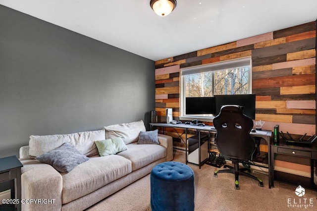 office area with light colored carpet and wooden walls