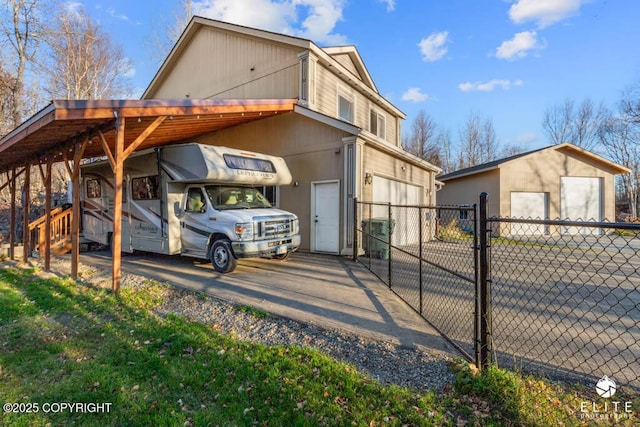 view of home's exterior featuring an outbuilding and a carport