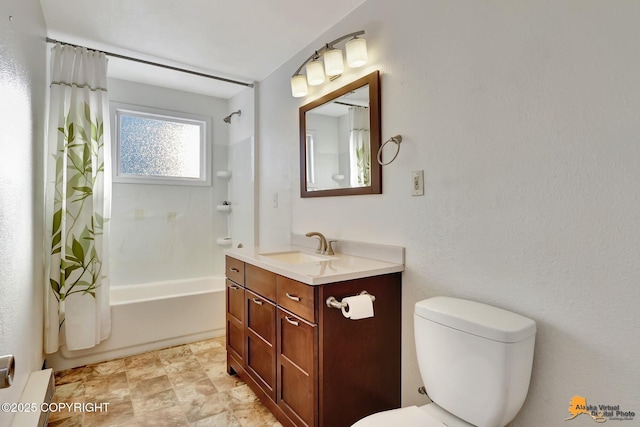 full bath featuring shower / tub combo, vanity, and toilet