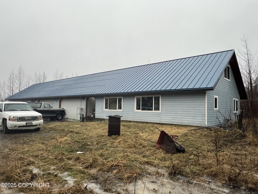 exterior space featuring a standing seam roof and metal roof