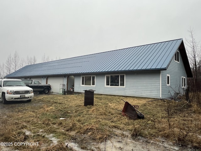 exterior space featuring a standing seam roof and metal roof