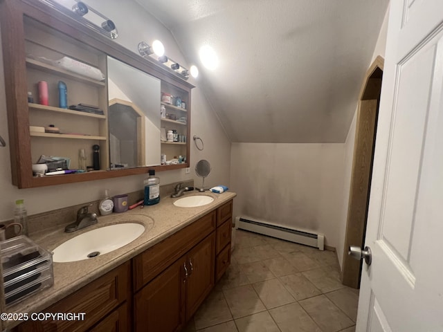 bathroom featuring a baseboard radiator, vanity, tile patterned flooring, and vaulted ceiling