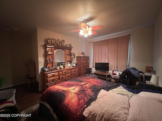 bedroom featuring dark hardwood / wood-style floors and ceiling fan