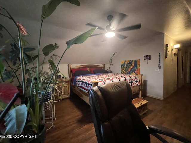 bedroom with dark wood-type flooring, ceiling fan, and vaulted ceiling