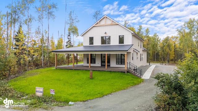 view of front of home with a porch and a front yard