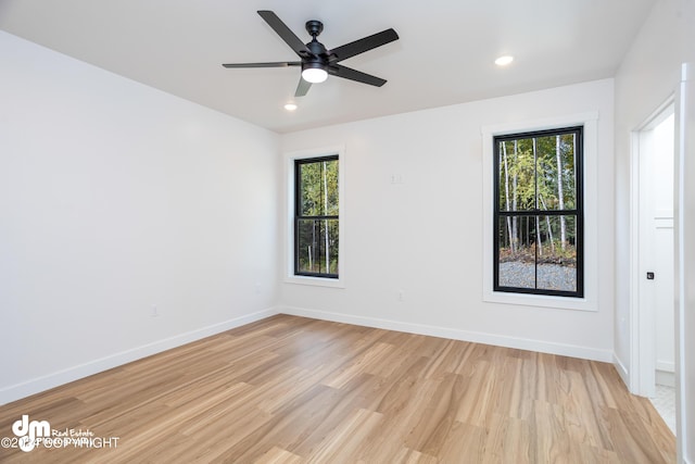 unfurnished room featuring light hardwood / wood-style floors and ceiling fan