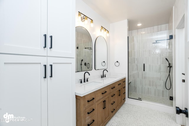 bathroom featuring tile patterned flooring, vanity, and an enclosed shower