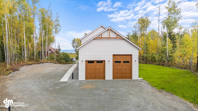 garage featuring a lawn