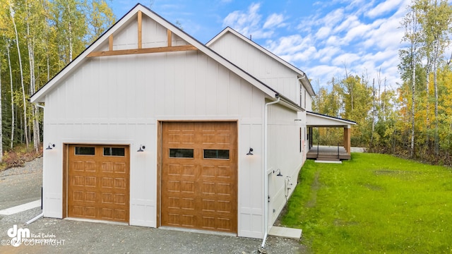 garage featuring a lawn