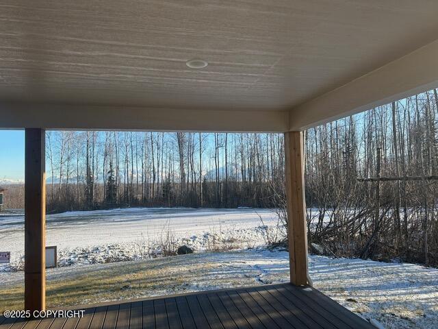 view of snow covered deck