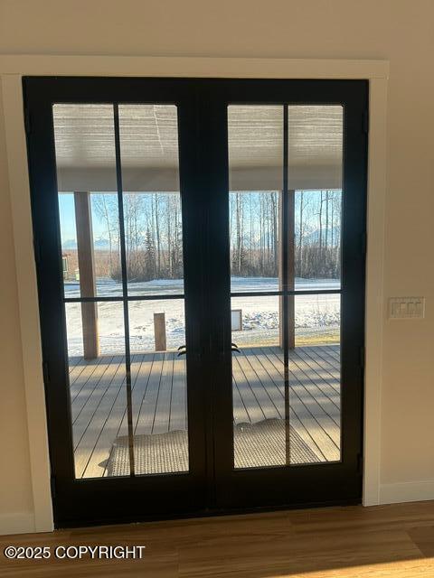 doorway to outside with hardwood / wood-style floors