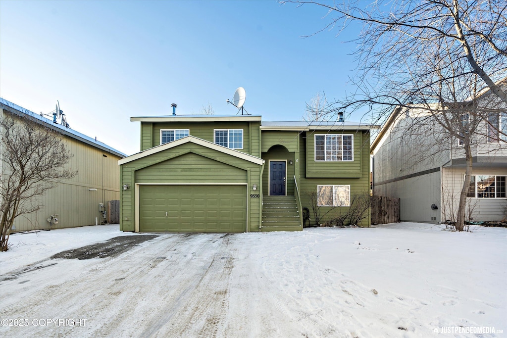 split foyer home featuring a garage