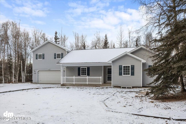 view of front of property with a garage and a porch