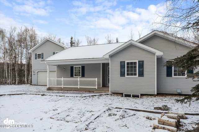 view of front facade with a garage and covered porch